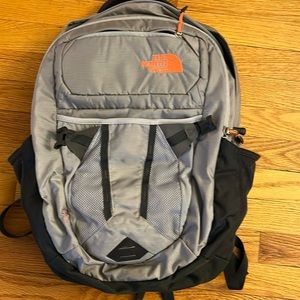 North face backpack with computer holder pocket grey orange details